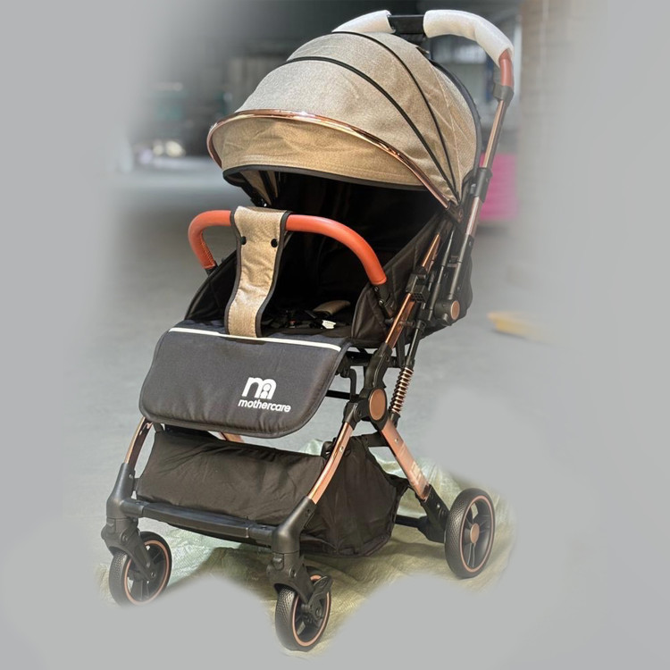 کالسکه مسافرتی دسته دو طرفه رو به مادر شو mothercare مادرکر